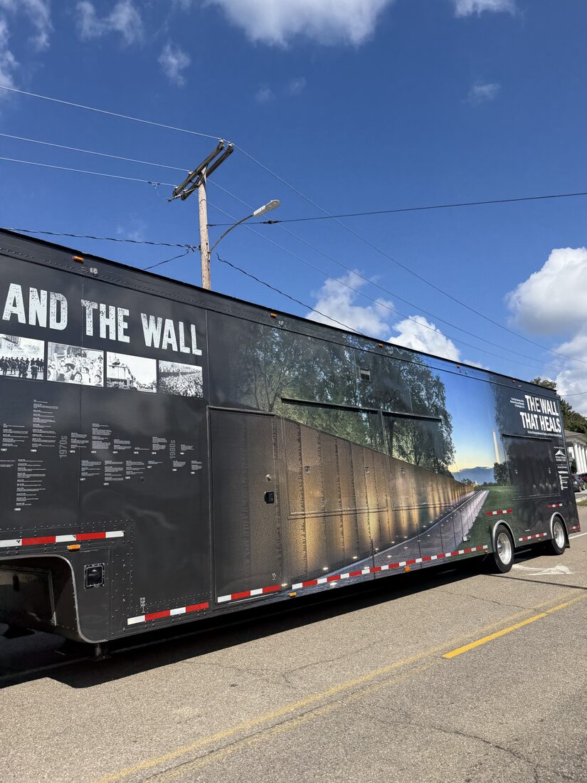 Vietnam Veterans Memorial imagery on the side of The Wall That Heals trailer
