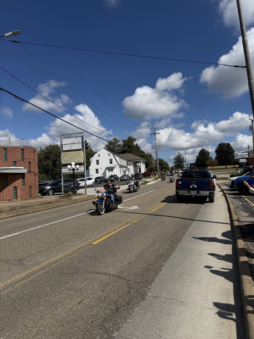 Motorcycle riders approaching along the street during the welcome procession